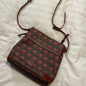 Gently used cross body Tampa Bay Buccaneers Dooney & Bourke bag